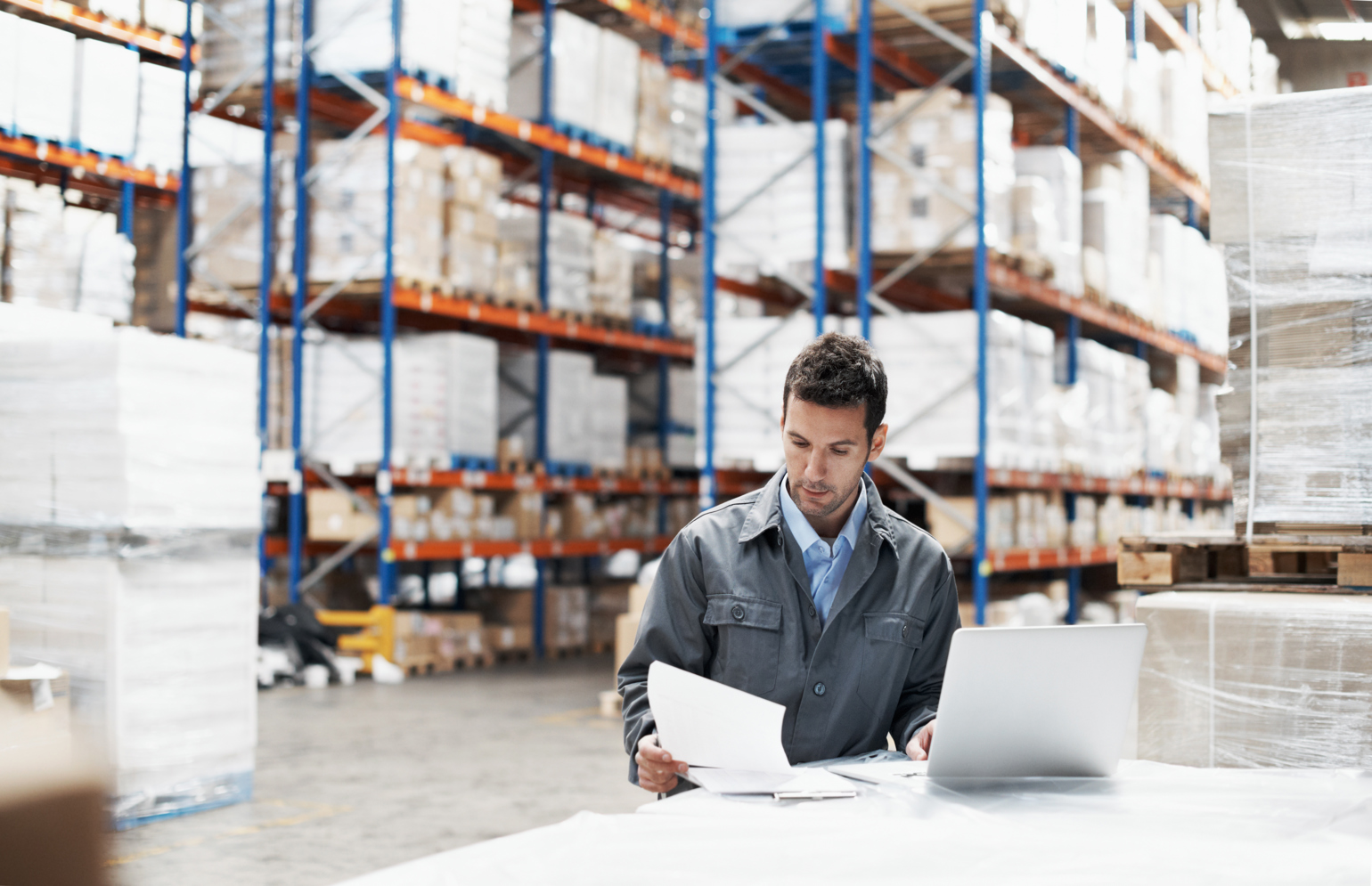 Worker At Computer Warehouse