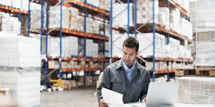 Worker At Computer Warehouse