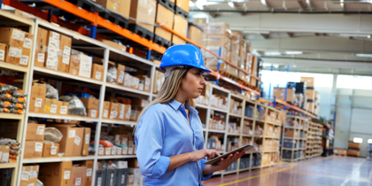 Woman Holding Tablet In Warehouse (1)
